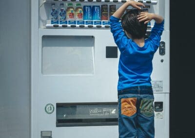 Kid looking at vending machine with diverse options